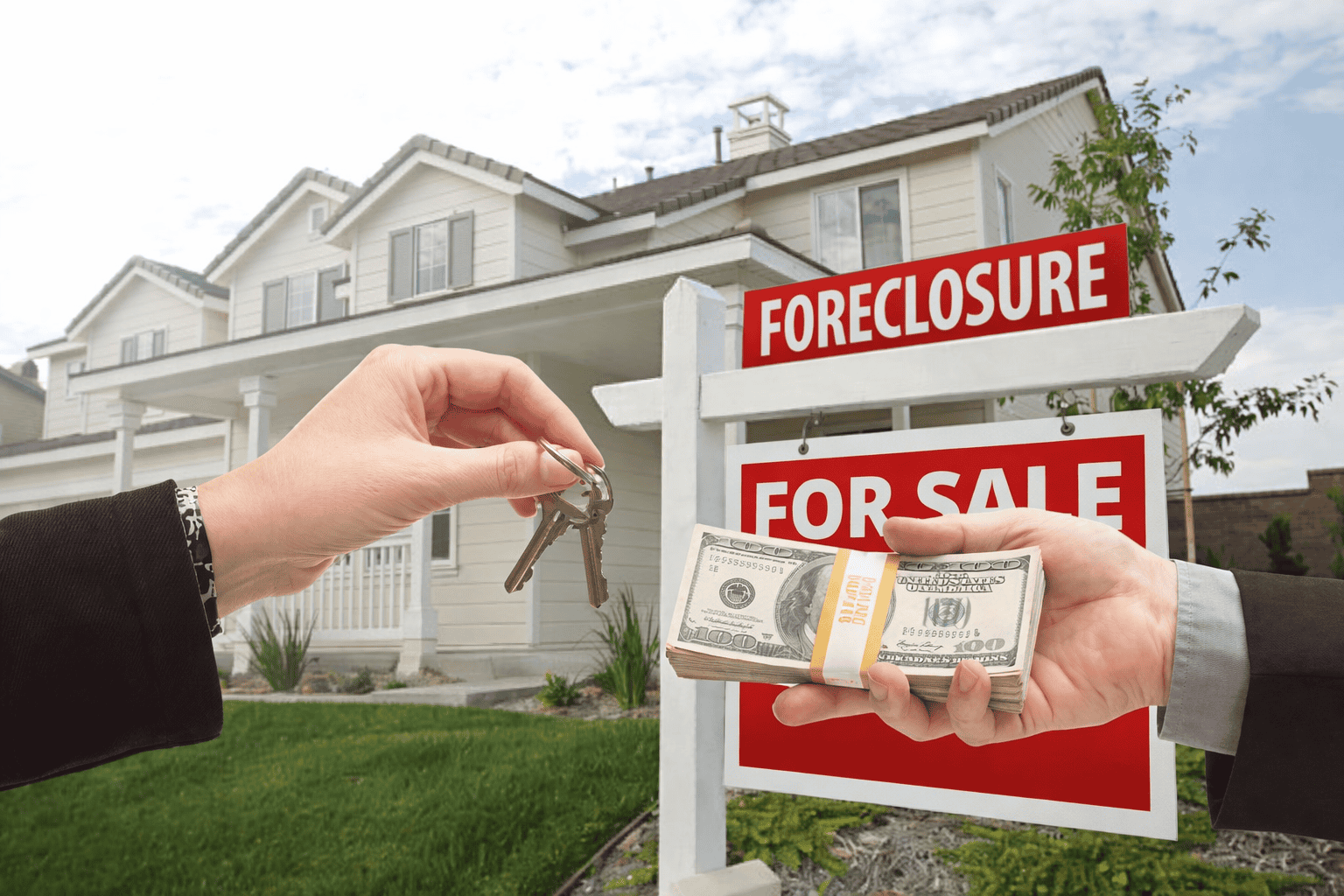Cash buyer exchanging money for house keys in foreclosure sale